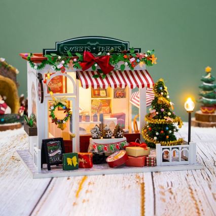 2Kids Toys - Miniatiūrinis namelis Kalėdinė saldainių parduotuvė 2xAAA