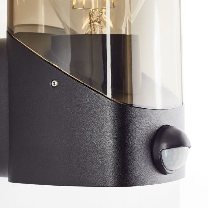 Brilliant - Lauko sieninis šviestuvas su jutikliu MINOU 1xE27/10W/230V IP44 juoda/dūminis