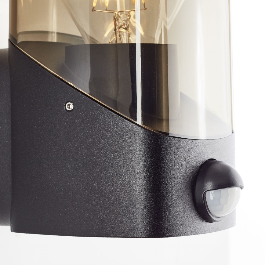 Brilliant - Lauko sieninis šviestuvas su jutikliu MINOU 1xE27/10W/230V IP44 juoda/dūminis