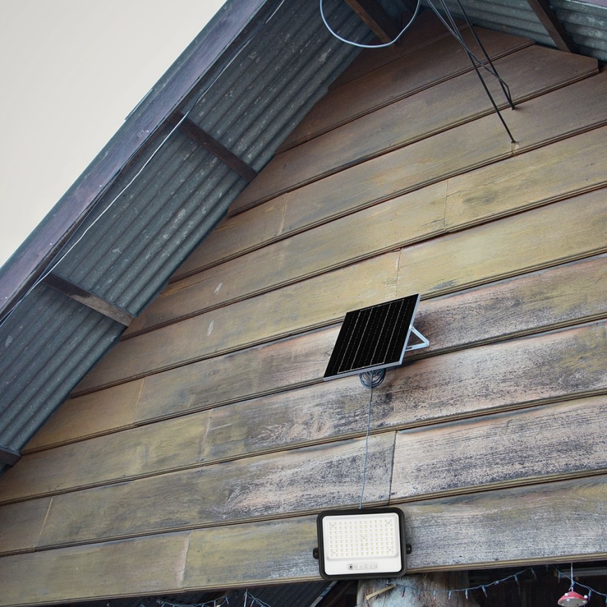 LED reguliuojamas saulės prožektorius LED/200W/3,2V 2000-8000K IP65 10000 mAh juodas + nuotolinio valdymo pultas