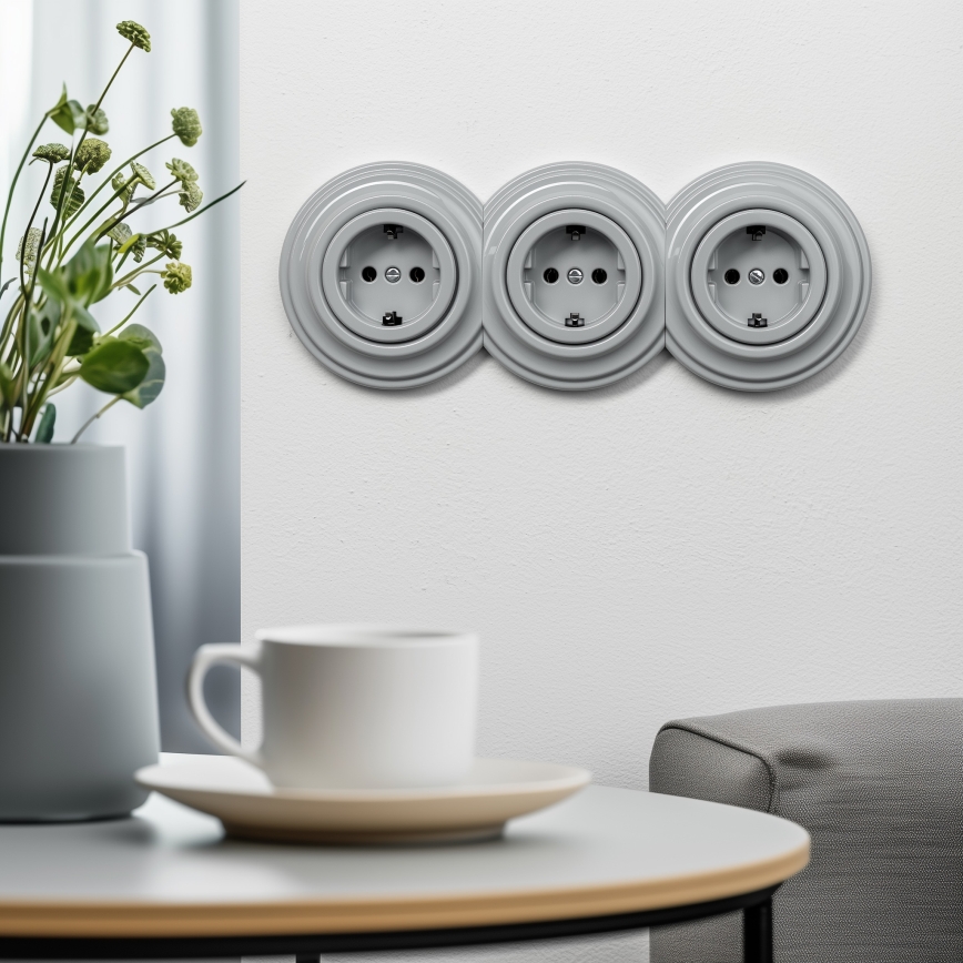 Kliklap - Triguba retro rozetė namams su rėmeliu SCHUKO 230V, pilka