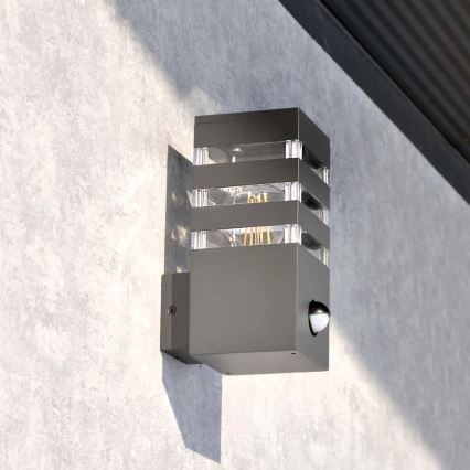 Lauko sieninis šviestuvas su jutikliu TEKSAS 1xE27/12W/230V IP44 antracito spalvos