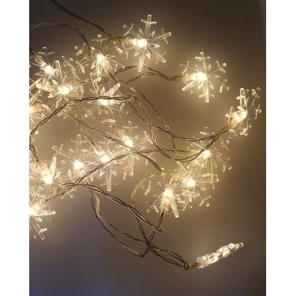 LED Kalėdinė lauko girlianda 20xLED/2xAA 2,2 m IP44 šiltai balta snaigės