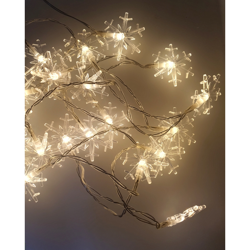 LED Kalėdinė lauko girlianda 20xLED/2xAA 2,2 m IP44 šiltai balta snaigės