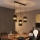 LED liustra ant laido BOGART 3xE27/15W/230V juoda/auksinė