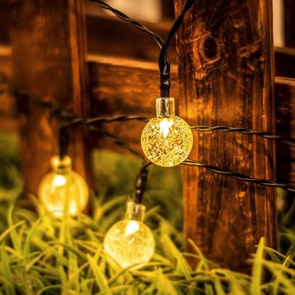 LED saulės energija maitinama dekoratyvinė girlianda, 30 LED / 8 funkcijų, 500 mAh, 6,5 m, IP67, šiltai balta