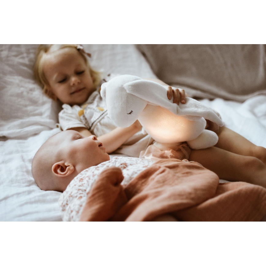 Moonie - Snuggle buddy su melodija ir šviesa zuikis 2.0 cream