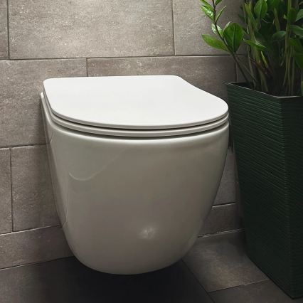 REA-C1259 - Pakabinamas unitazas su sėdyne CARLO MINI TORNADO RIMLESS keramika / blizgi balta
