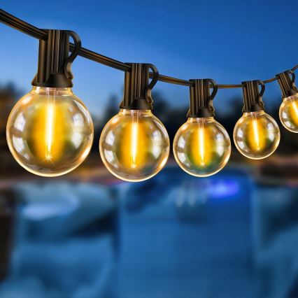 Dimeriuojama lauko LED dekoratyvinė girlianda 25xE12/1W/24/230V 17,5 m IP65 juoda + nuotolinis valdymas