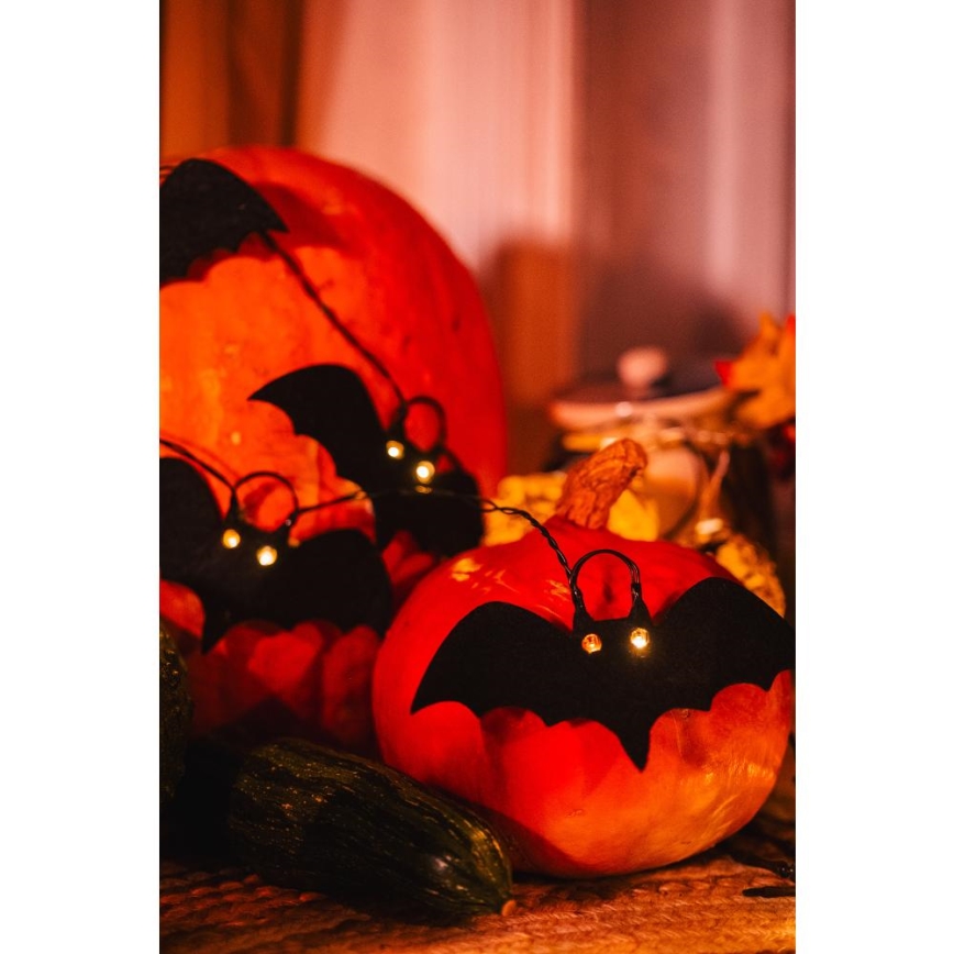 Dekoratyvinė LED grandinė HALLOWEEN 10xLED/2xAA/šilta balta 1,3m šikšnosparniai