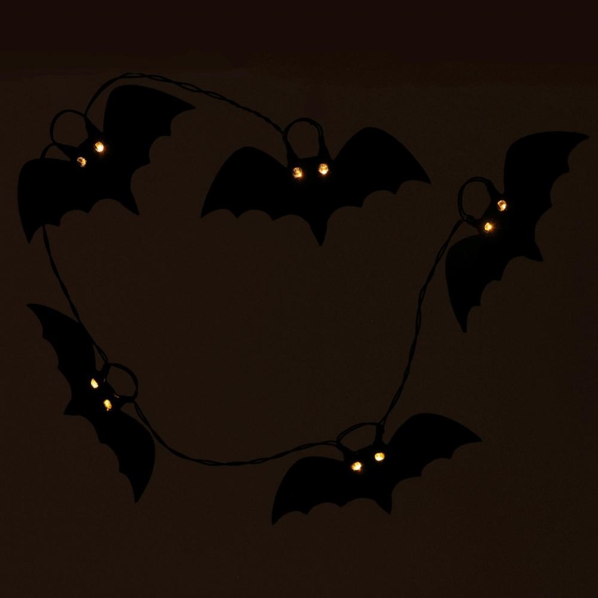 Dekoratyvinė LED grandinė HALLOWEEN 10xLED/2xAA/šilta balta 1,3m šikšnosparniai