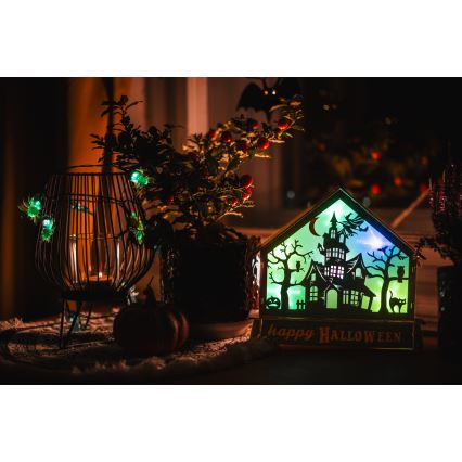 LED Dekoracija HALLOWEEN LED/2xAA/įvairiaspalvė baisi namelis