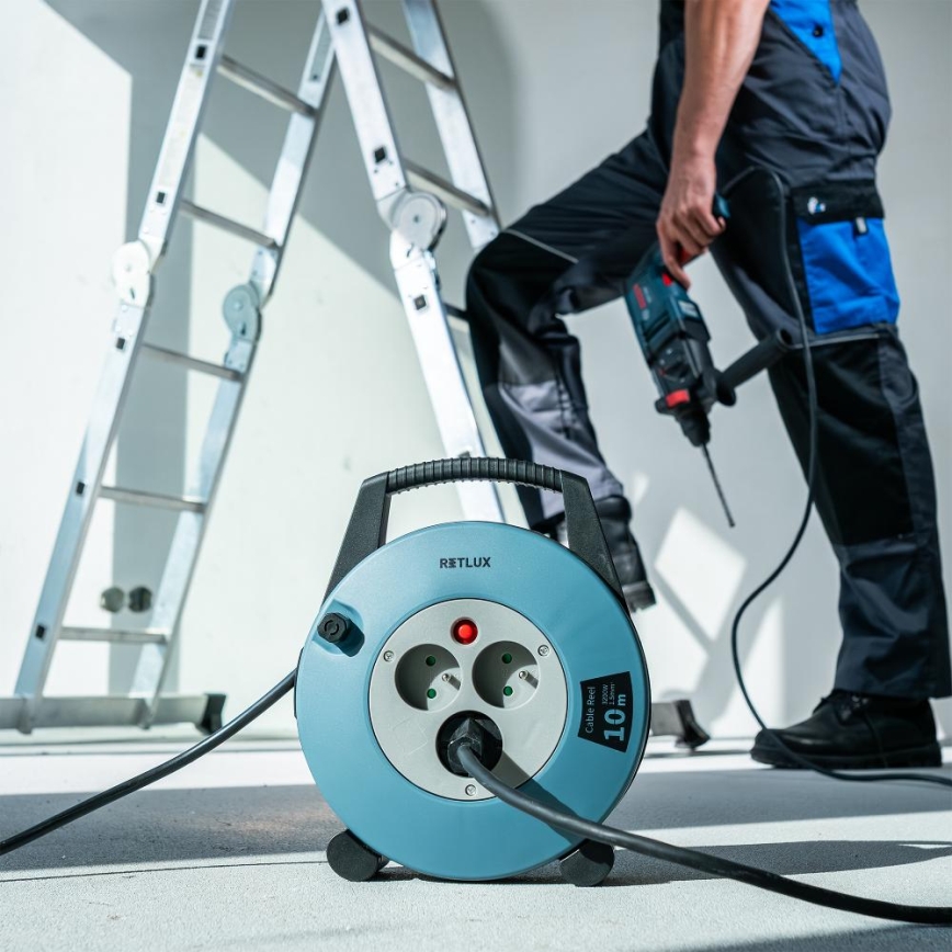 Retlux - pratęsimo laidas ant ritės su 3 lizdais, E tipo, 10 m, mėlynas/juodas